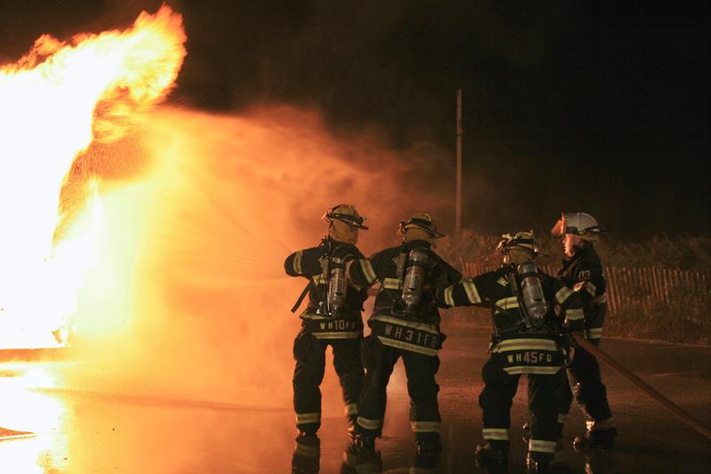 WHFD Members work the hose at propane training in 2009