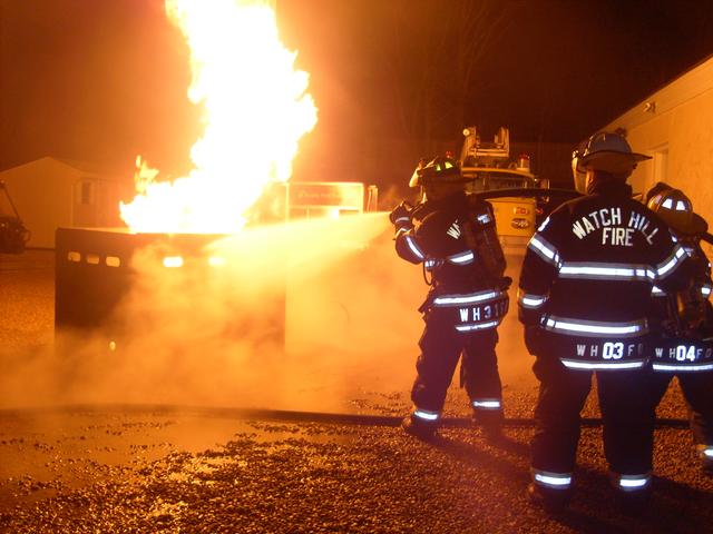 Lieutenant Chris Andaloro and Captain Jane Perking attack a Dumpster Fire with Dep. Chief Peacock overseeing. 