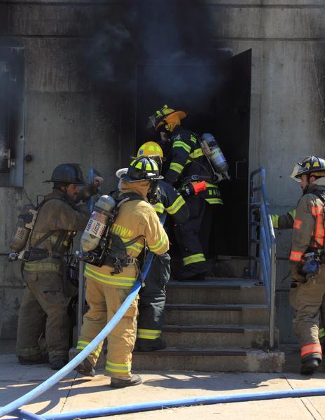 Lieutenants Koretski, and Majeika lead crews inside at live fire training at the Union Fire District Burn Building in September 2013. 