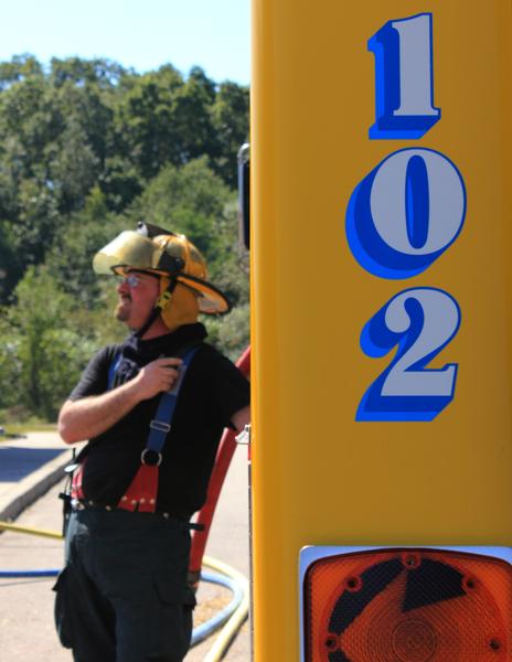 Firefighter Chris Tehan pumps Engine 102 at live fire training at the Union Fire District Burn Building in September 2013. 